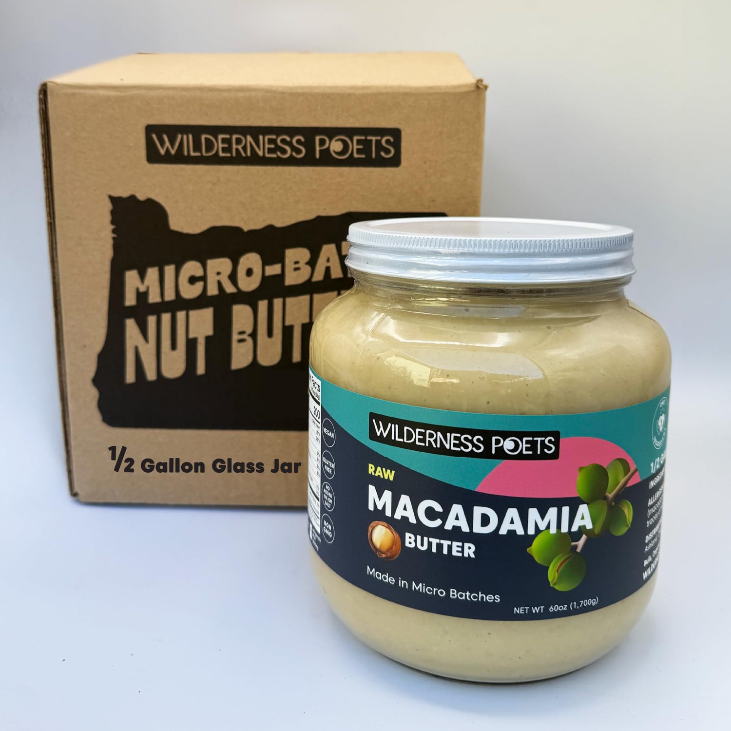 Wilderness Poets Raw Macadamia Butter in a half-gallon glass jar for bulk use.