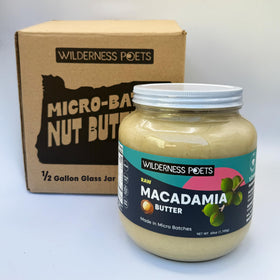 Wilderness Poets Raw Macadamia Butter in a half-gallon glass jar for bulk use.