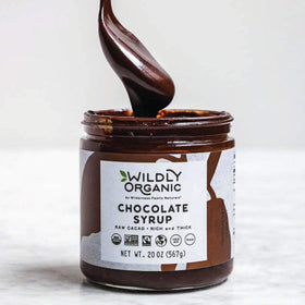 Close-up of Wildly Organic Chocolate Syrup label highlighting organic, fair trade origins.