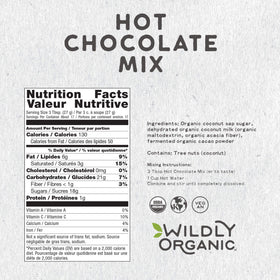 Wildly Organic hot chocolate mug pour showing creamy, dairy-free drink.