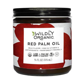 Wildly Organic red palm oil bottle pouring, ideal for sautéing and color