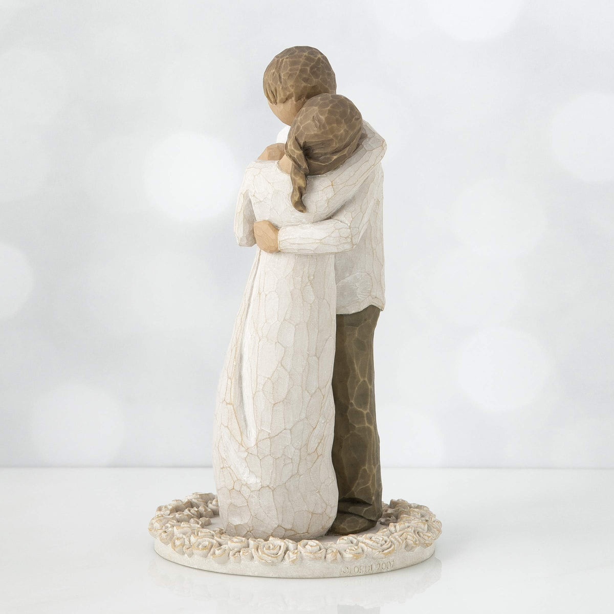 Willow Tree Promise cake topper cream shirt dark pants display for classic cake presentation