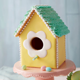 Wilton yellow icing covers cookies and cakes for cohesive decorating.