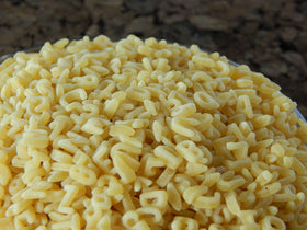 WinCrest Alphabet Pasta added to a pot for kid-friendly meals.
