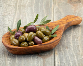 Wine Country Gift Baskets Genoa salami on a platter for savory bites.