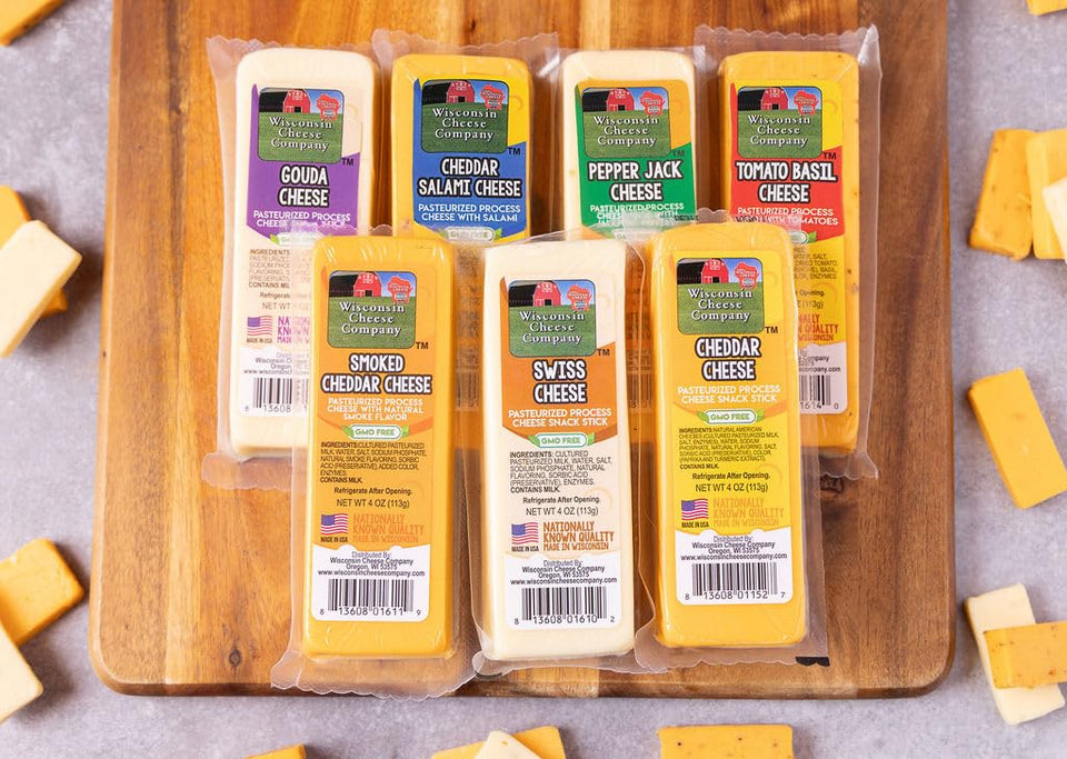 Wisconsin Cheese Company cheddar block on a charcuterie board, ideal for entertaining.