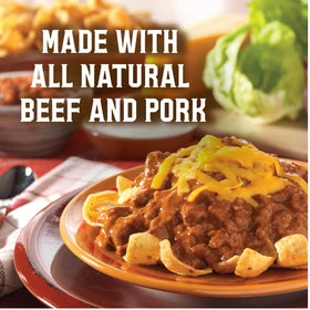 Wolf Brand Chili No Beans opened can with steaming chili ready to serve.