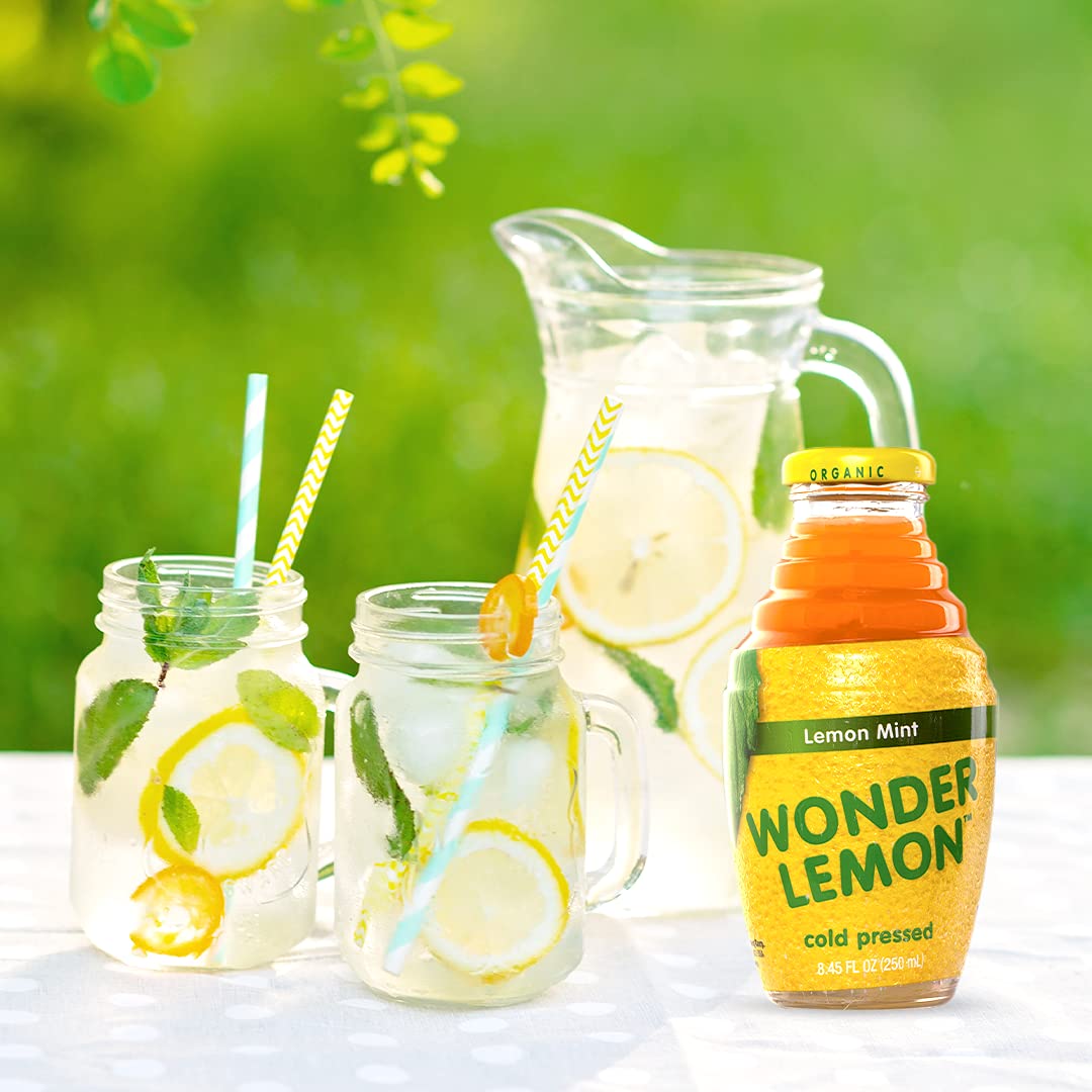Close-up of smooth, cold-pressed juice being poured from Wonder Lemon bottle.