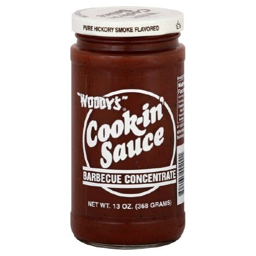 Woody's Cook-in Sauce Barbecue Concentrate pour enhances grilled meat with smoky flavor