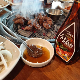 Woori Cham mando dipping pairs with steamed dumplings for flavor.