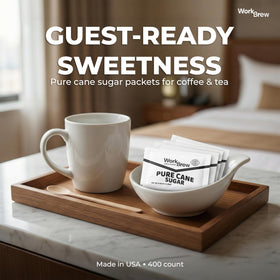 WorkBrew packets beside a coffee cup, emphasizing fast-dissolving sweetness.