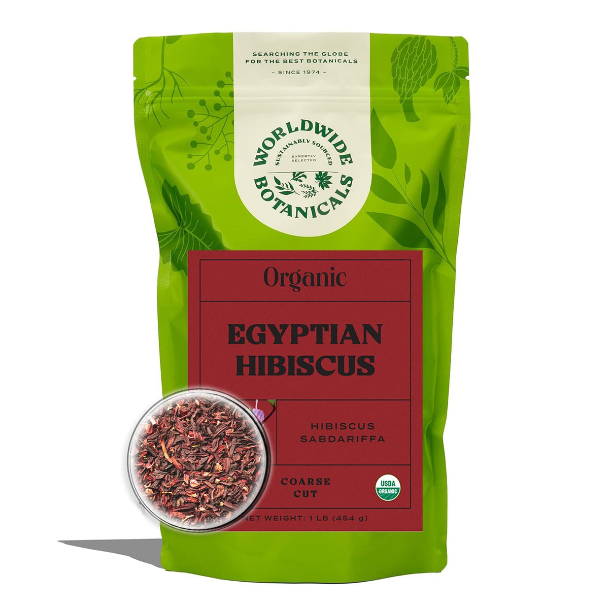 Worldwide Botanicals Organic Hibiscus Tea loose leaf in scoop—vibrant flavor potential.