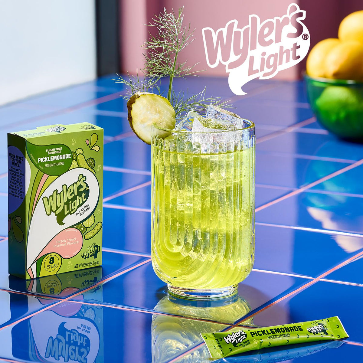 Glass of cold water with diluted Picklemonade showing dill twist and lemon notes.