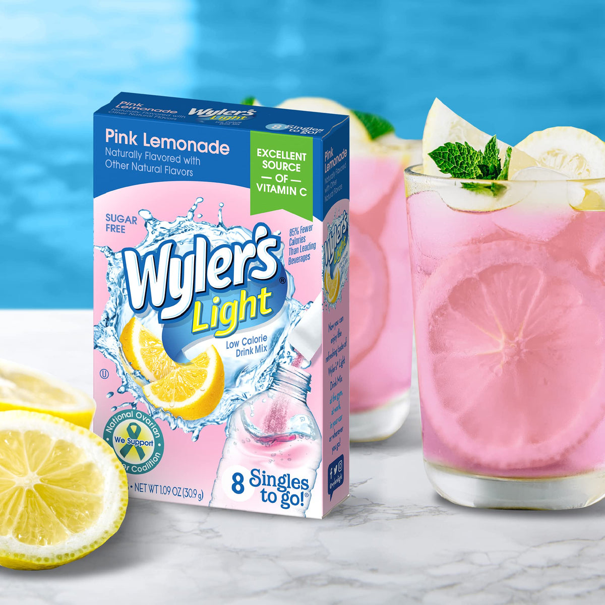 Wyler's Light Pink Lemonade packet being poured into a water bottle.
