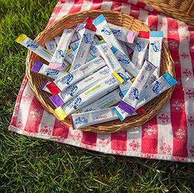 Wyler's Light Raspberry Lemonade bottle with packets on a desk for office hydration