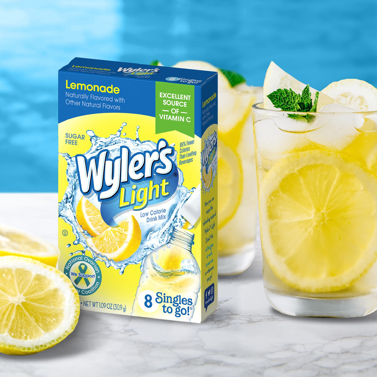 Powder being poured into water bottle with Wyler’s Light Lemonade