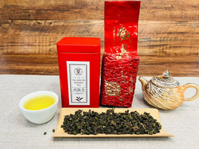 Xin Qing Tieguanyin brewed cup showing amber infusion and aroma.