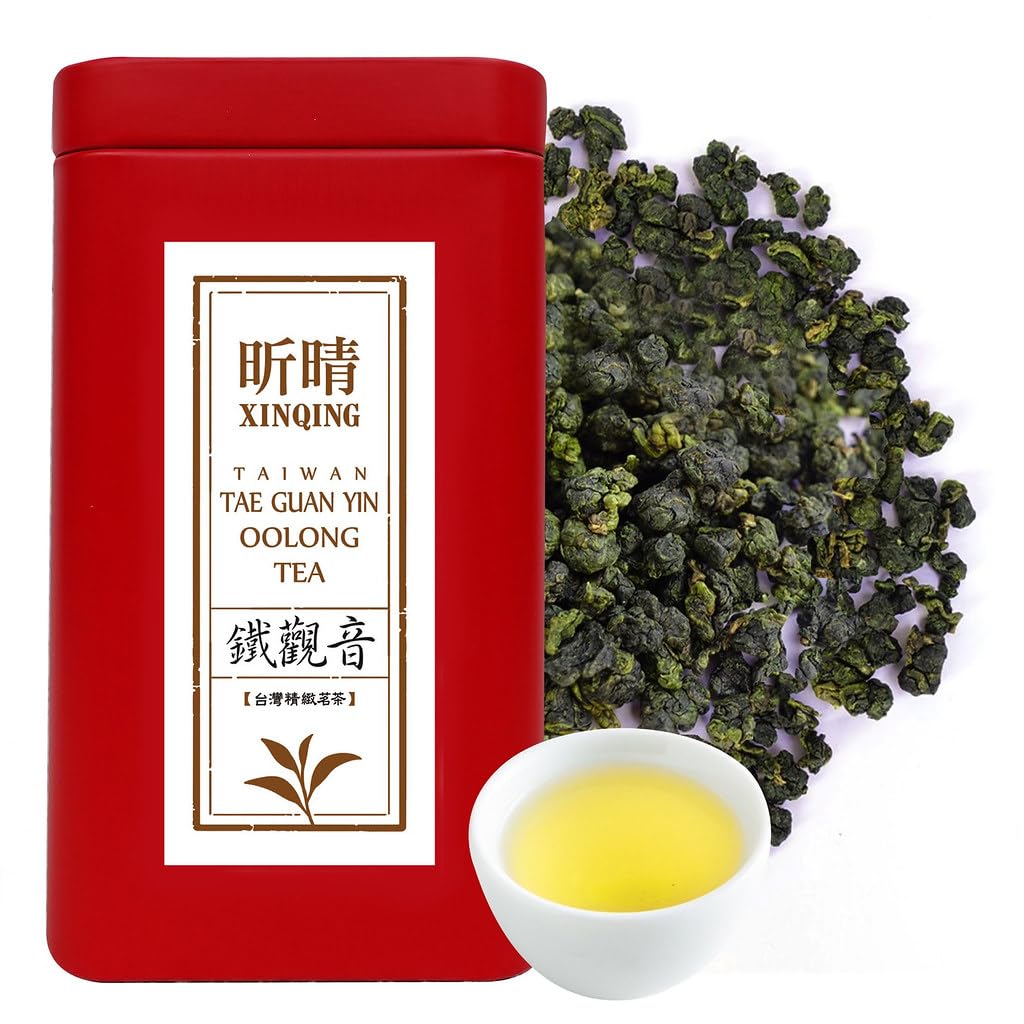 Xin Qing Tieguanyin tea leaves on a wooden tray, ready for infusion.