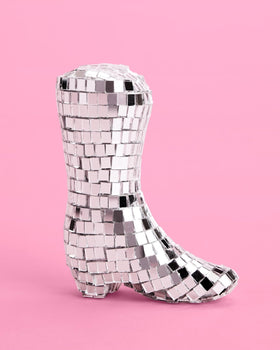 xo Fetti disco ball topper sparkles under party lights for standout cake.