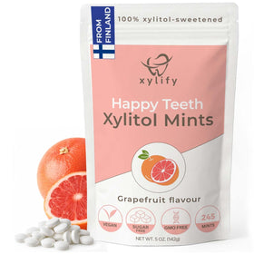 Xylify Happy Teeth grapefruit mints in a bottle for on-the-go oral care and fresh breath.