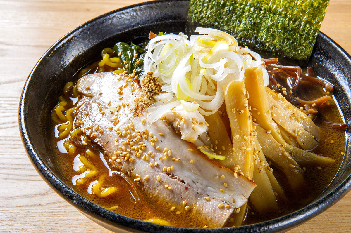 Yamasa ramen bowls steaming with fragrant broth and noodles.