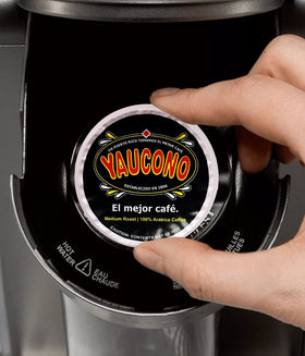 Open 72-count box of Yaucono pods on a kitchen counter.