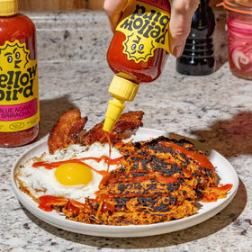 Yellowbird Blue Agave Sriracha pour shot showing glossy sauce ready