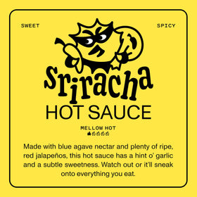 Savory spoonful of Yellowbird Blue Agave Sriracha on tacos