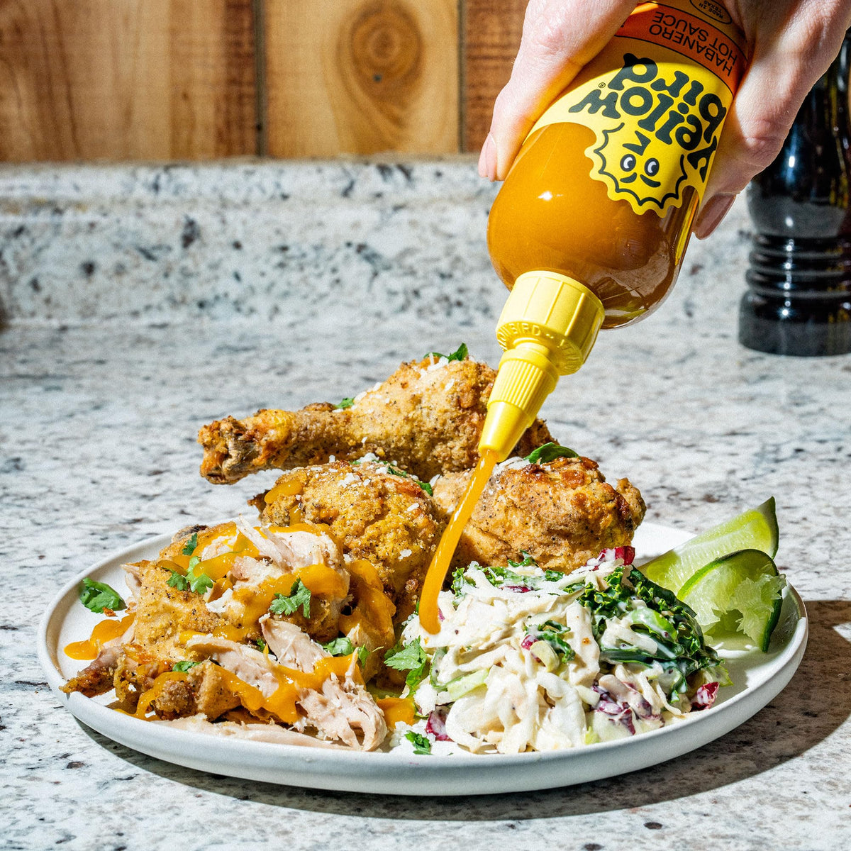 Yellowbird Classic Habanero sauce poured—tangy kick to elevate recipes.