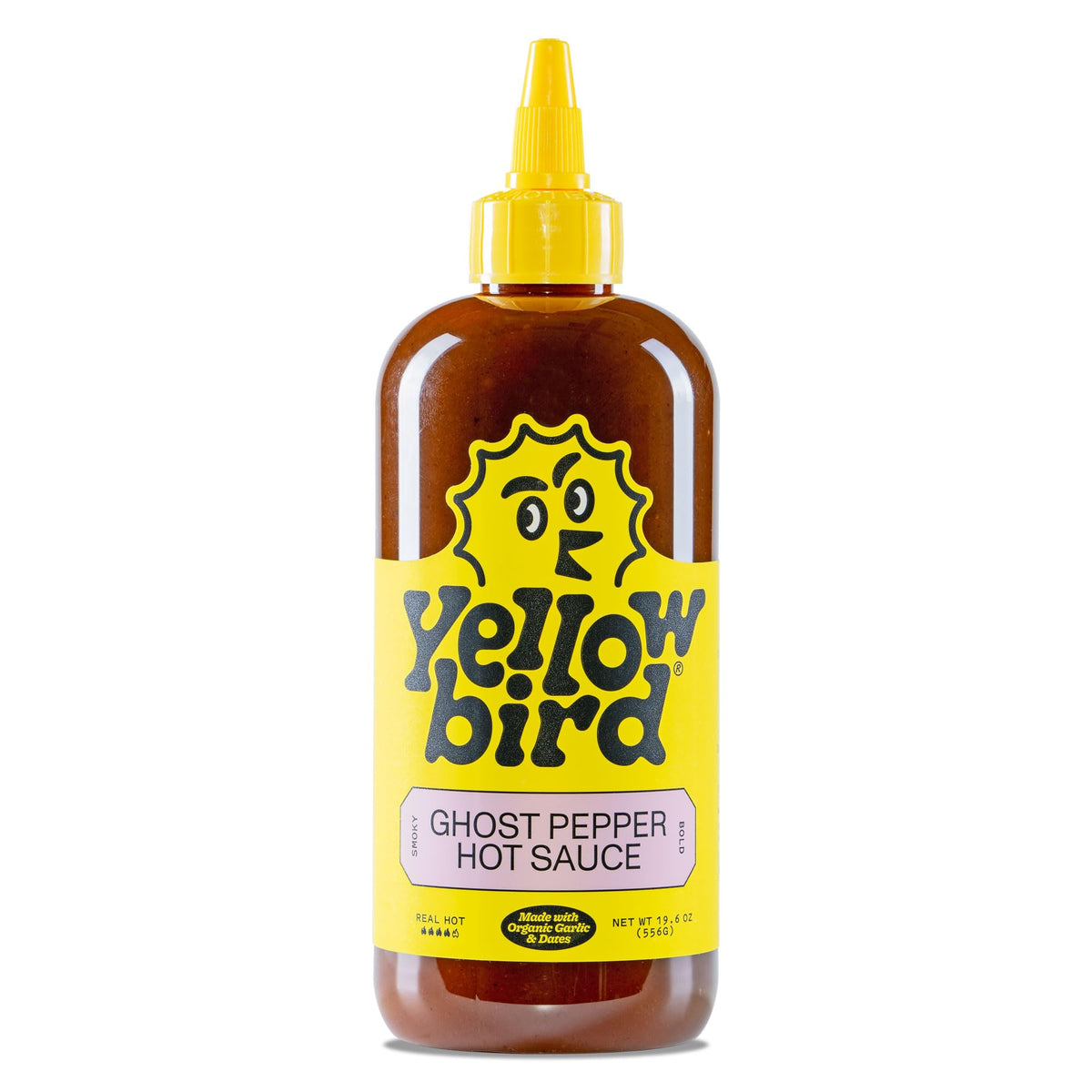 Yellowbird Ghost Pepper hot sauce bottle on table ready to spice up meals.