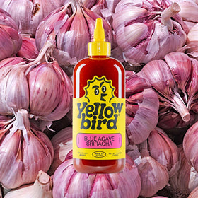 Made in Texas badge on Yellowbird Blue Agave bottle