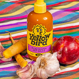 Yellowbird Plum Reaper bottle tilt—eye-catching packaging that invites experimentation in recipes.