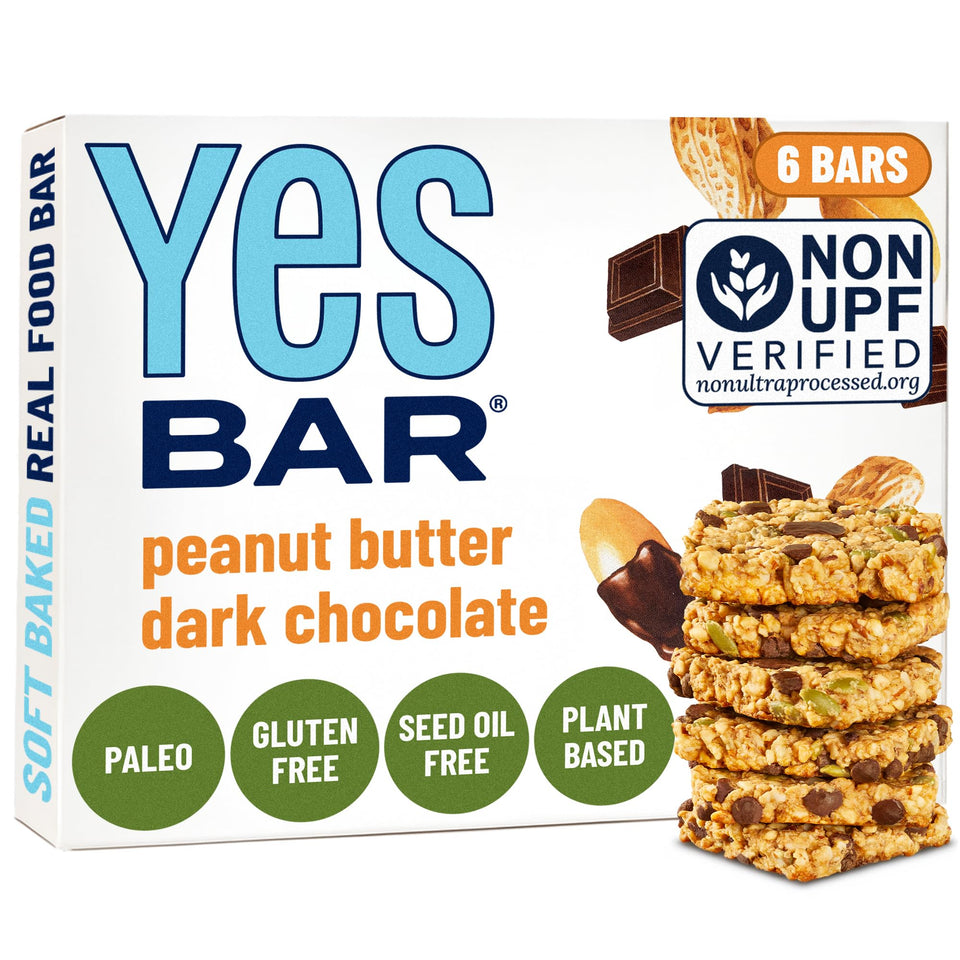 The YES Bar peanut butter dark chocolate bar close-up shows soft, chewy texture for snacking.