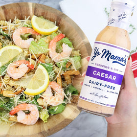 Yo Mama’s Foods Keto Ranch & Caesar glass-bottle closeup highlights tangy, dairy-free flavor.