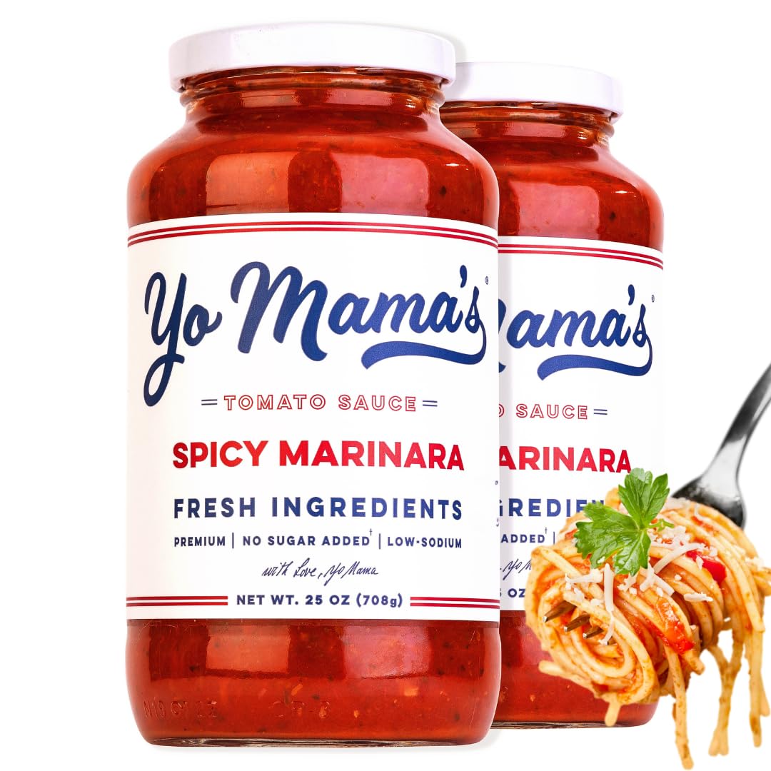 Yo Mama’s Foods Keto Spicy Marinara bottle poured, highlighting bold flavor without added sugar.