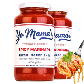 Yo Mama’s Foods Keto Spicy Marinara bottle poured, highlighting bold flavor without added sugar.