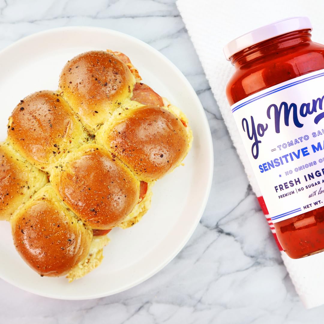 Yo Mama’s Sensitive Marinara being poured over al dente pasta for gluten-free dinner ideas.