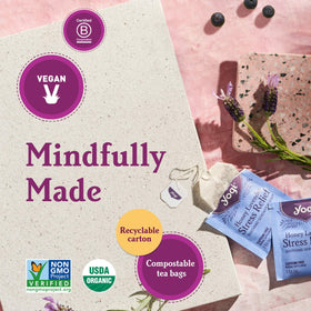 Pouring hot water over a Yogi Blueberry Sage tea bag for a caffeine-free ritual.