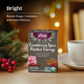 Yogi Cranberry Spice Positive Energy tea box packaging on a shelf.