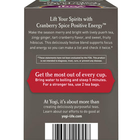 Steaming cup of Yogi Cranberry Spice Positive Energy tea highlighting aroma and flavor.