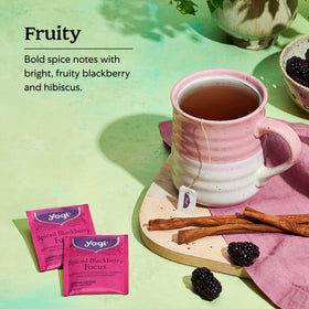 Brewing Yogi Spiced Blackberry Focus Tea in a mug with rich amber color.