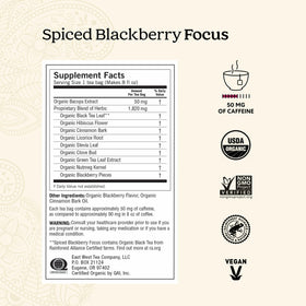 Yogi Spiced Blackberry Focus Tea bags steeping in hot water with warm spice aroma.