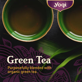 Four-pack display of Yogi Tea Pure Green Tea boxes, value for home or office.