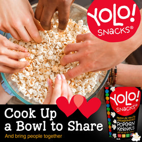 YOLO! family enjoying popcorn during movie night together.