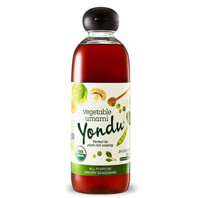 Yondu Organic Umami sauce bottle on kitchen counter enhances flavor with plant-based umami