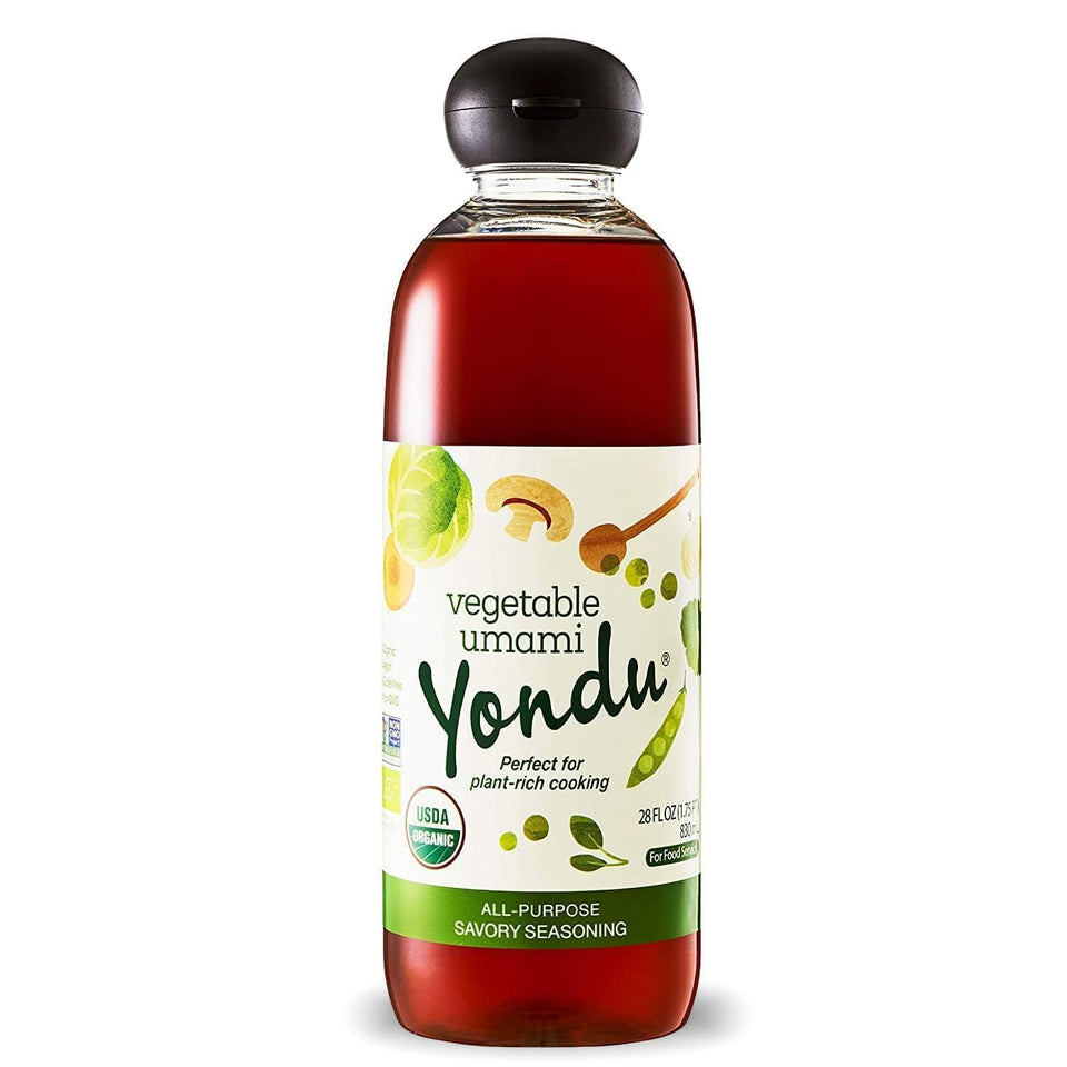 Yondu Organic Umami sauce bottle on kitchen counter enhances flavor with plant-based umami