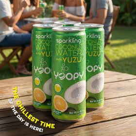 Chilled Yoopy sparkling coconut water with yuzu served in a glass.