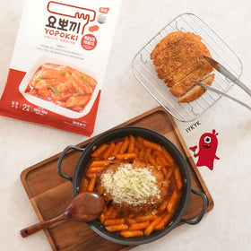 Yopokki rice cakes in sweet-mild sauce simmering on stove, quick dinner idea.