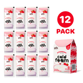 YULU FOODS Strawberry Instant Cold Foam Stick pouring into iced coffee to create café-style foam.