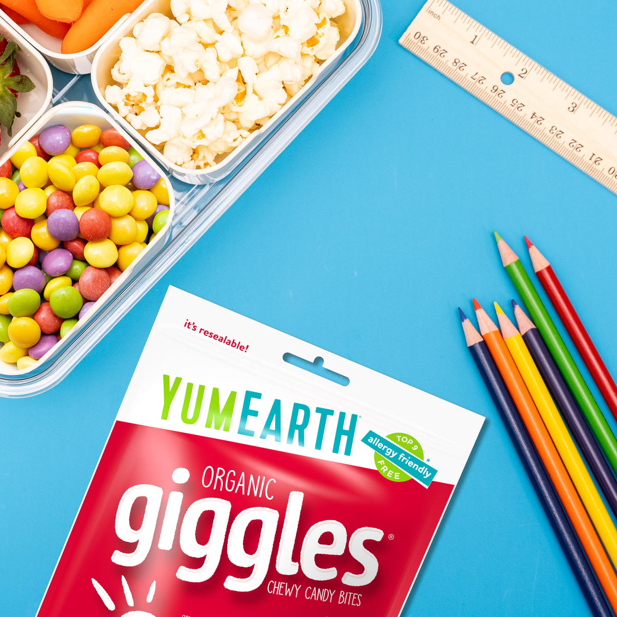 YumEarth Giggles party snack bowl filled with colorful bites.